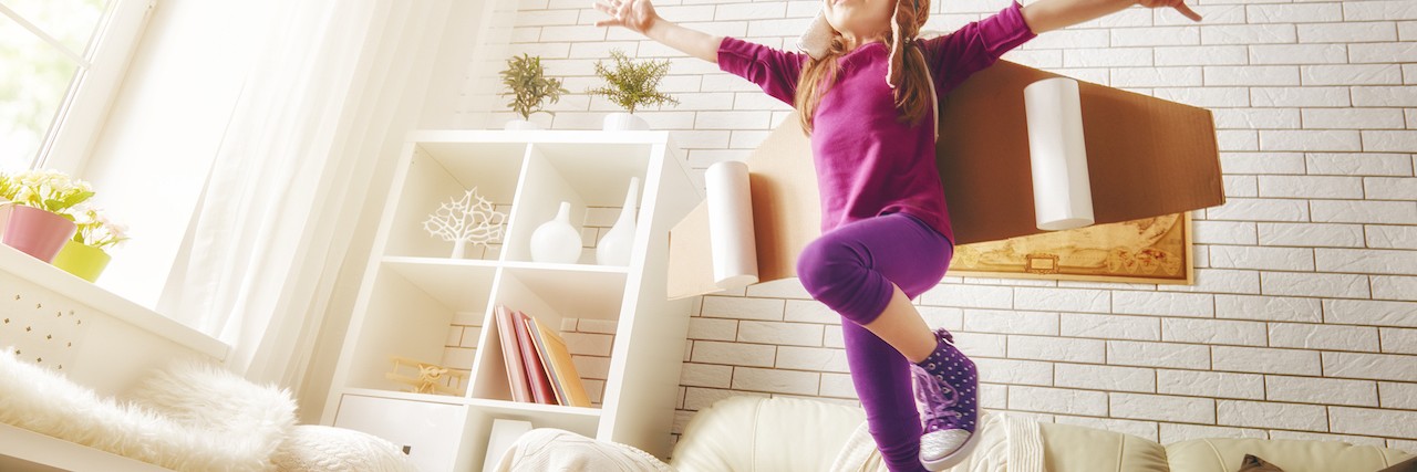 Autism and Not Being Interested in 'Age-Appropriate' Things child plays in an astronaut costume and dreams of becoming a spaceman.