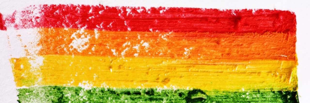 Orlando Shooting Letter to LGBTQ People Struggling With Mental Illness a rainbow flag painted in a textured background