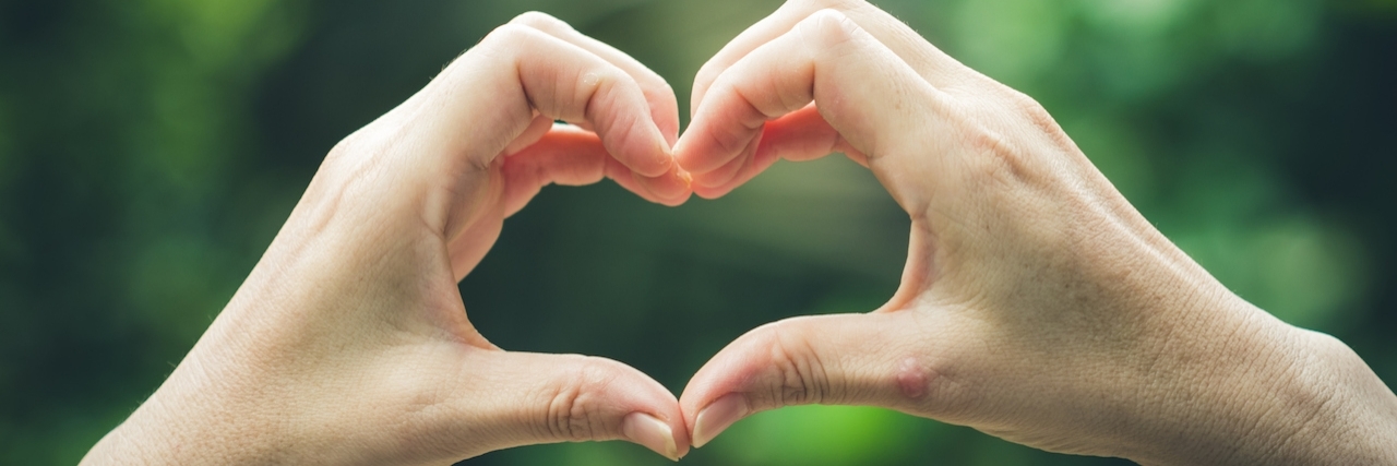 What Multiple Sclerosis Taught Me About Kindness hands making the shape of a heart
