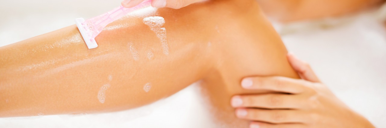 Blindness and Answering Personal Hygiene Questions Woman shaving her legs while lying in bathtub.