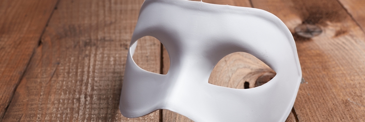 Why I Don't Always Tell People About My Illness From Brain Injury White Venetian mask on the table