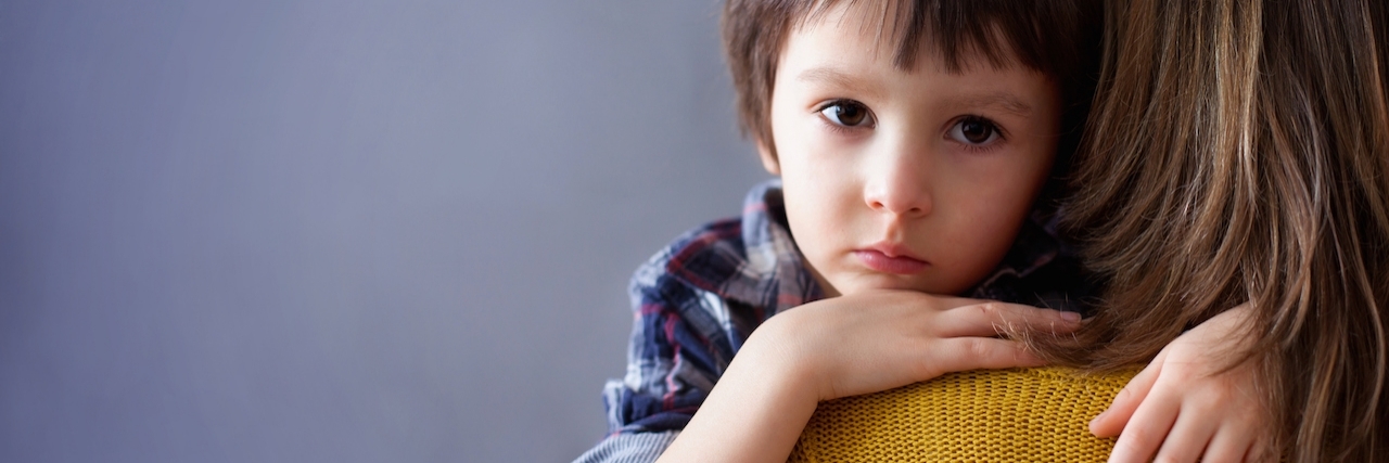 Tips for Talking to Children After Suicide Loss Sad little child, boy, hugging his mother