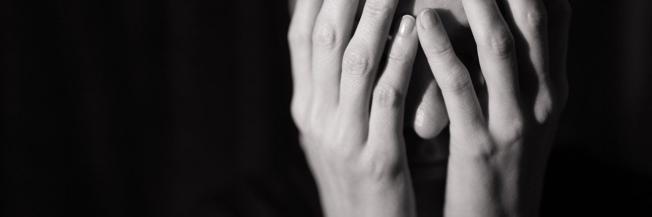 Letter to People Whose Self-Harm Scars Have Been Called 'Disgusting' woman covering her face