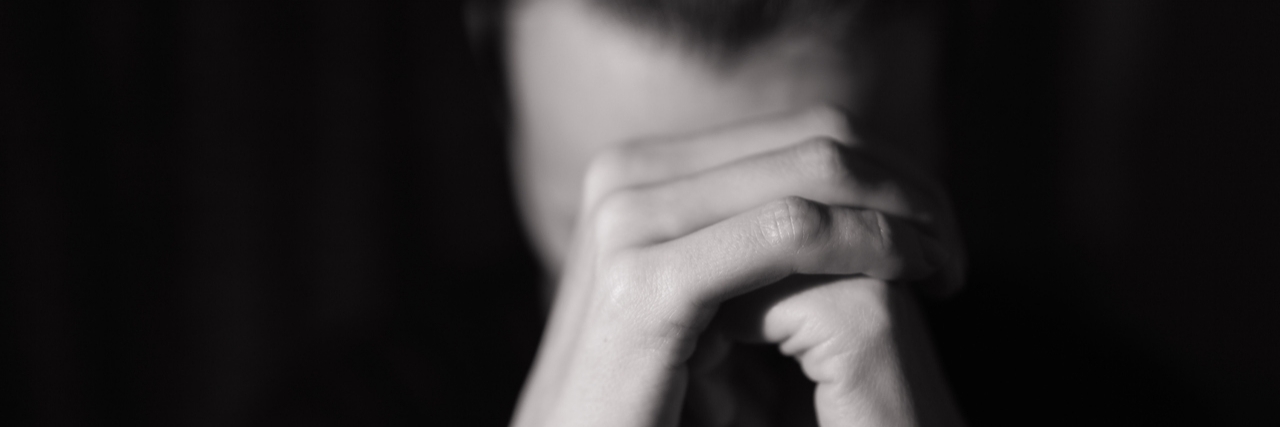 Extreme Anxiety in the Morning and at Night: My Experience Black and white photo of someone holding closed hands in front of face