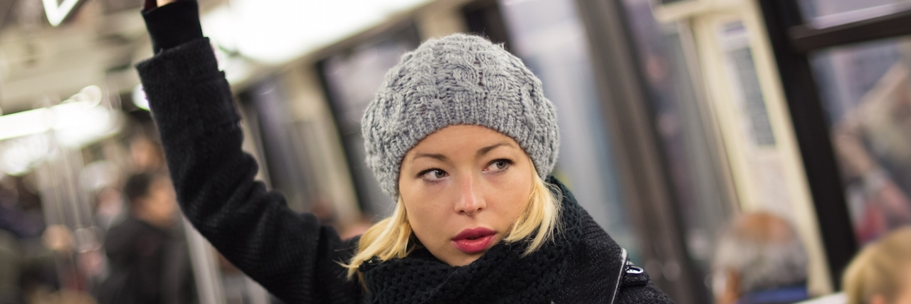 Learning to Slow Down With Lupus and Sjogren's Syndrome Woman on subway.