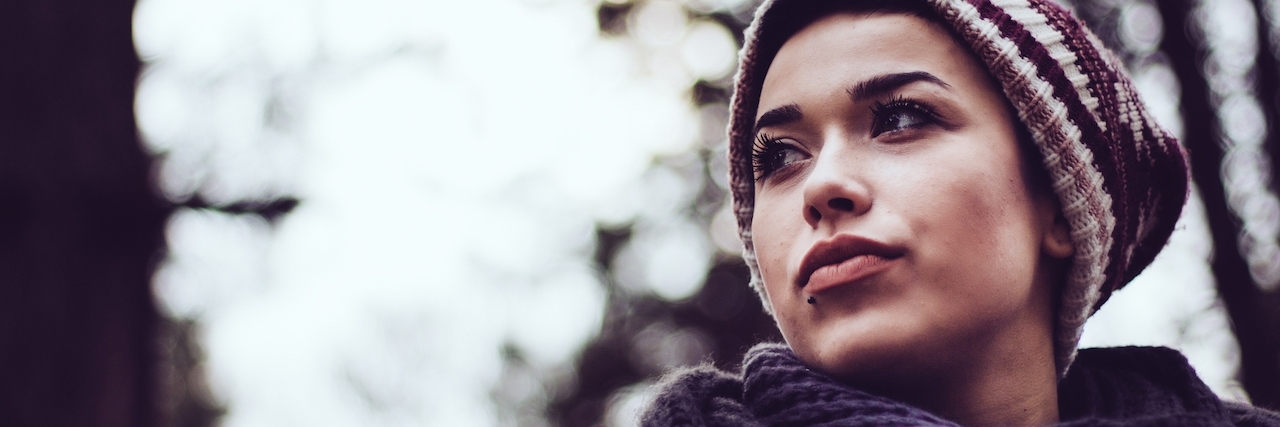 Secret Signs of My Anxiety Woman in a forest or park, looking to the side