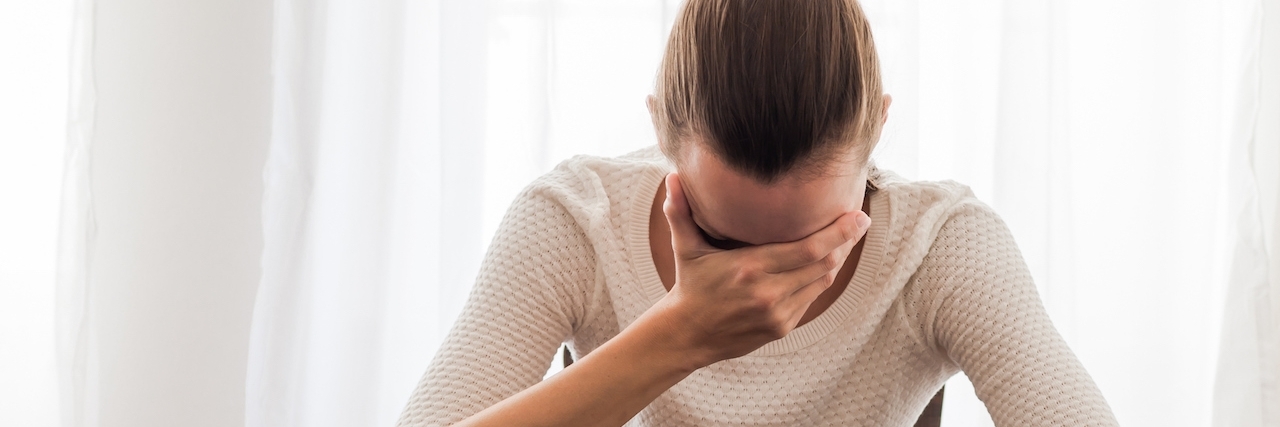 Ashamed of Needing to Take Time Off Work for Illness businesswoman with head in hands