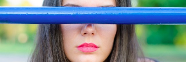 girl with a blue bar over her eyes