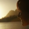 Woman Watching Sunset over Lake