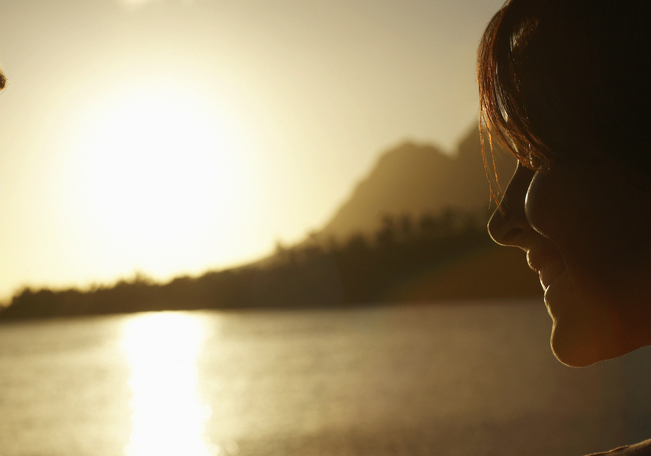 Finding Strength After a Reflex Sympathetic Dystrophy Diagnosis Woman Watching Sunset over Lake