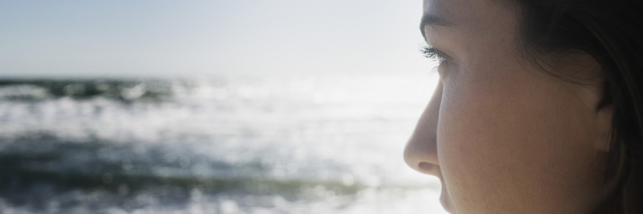 Learning to Apologize to Myself for the Self-Hate Cropped Profile of Woman Gazing at Ocean