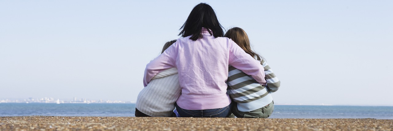 What I've Learned About Being a Mom of a Child With Special Needs Mother and daughters sitting on a beach