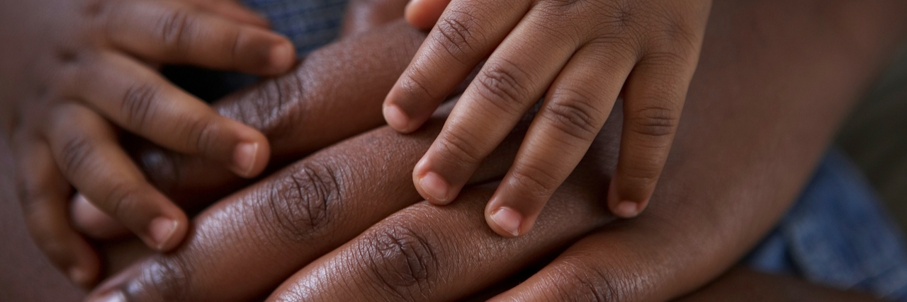 To the Daughter My Endometriosis Might Never Let Me Have babies hands on top of mums hands