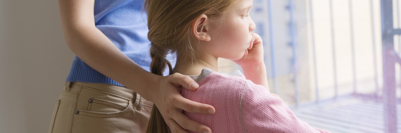 Growing Up With Juvenile Dermatomyositis Mother and daughter looking out window