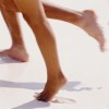 legs running in sand