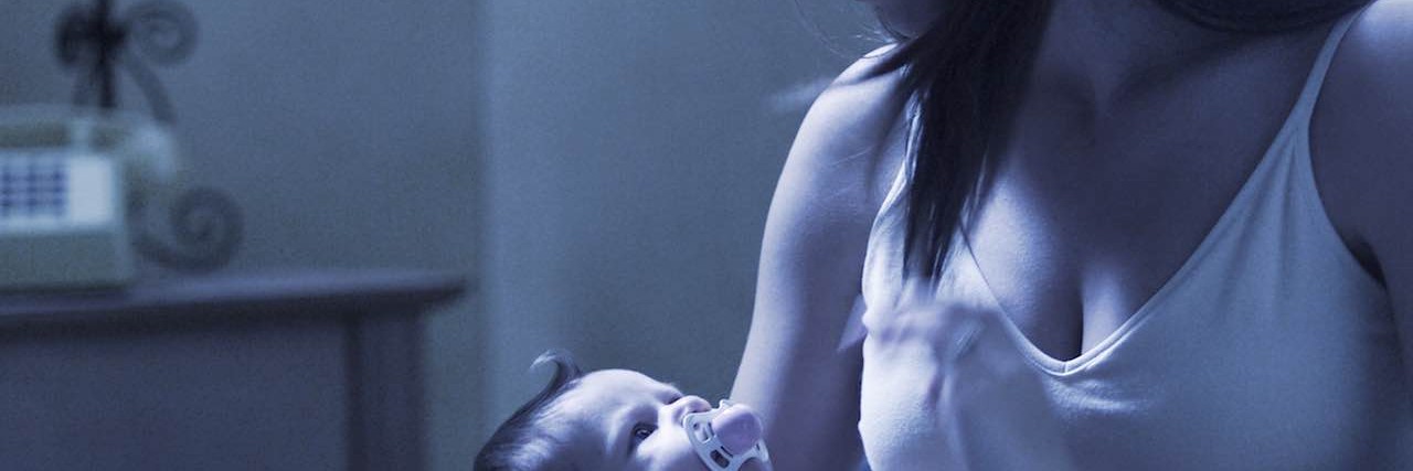 Can't Sleep: What Special Needs Moms Think About at Night a young mother holds her newborn baby at night