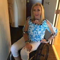 Amy Van Dyken-Rouen in a wheelchair