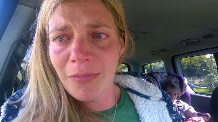 woman crying in her car