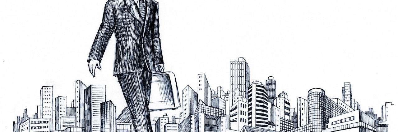 Drawing ofoversized businessman walking over a city