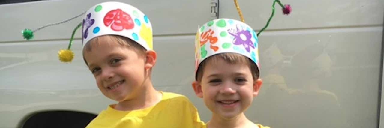 What the Person Who Commented on My Son's Lack of Speech Didn't Know brothers smiling with bug hats on