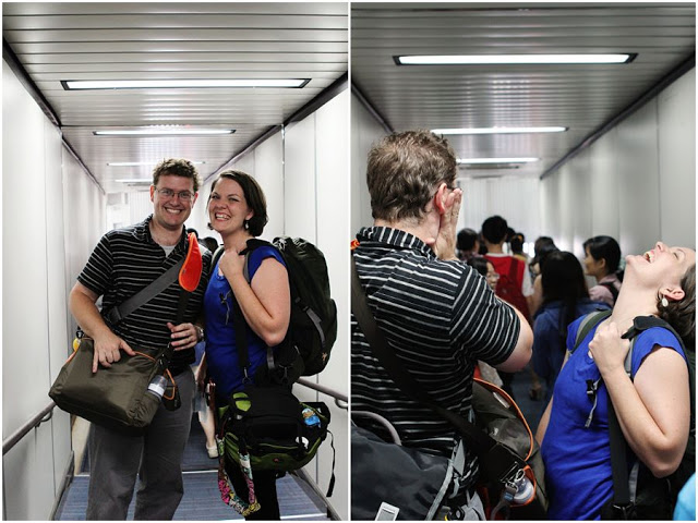 The author and her husband, laughing, waiting to board a plane.