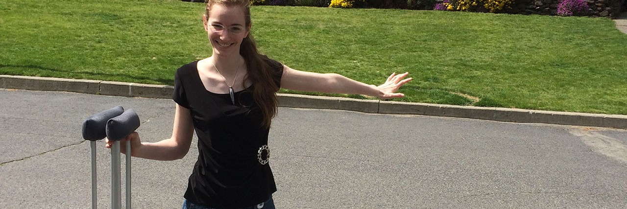 Learning to Appreciate Life While Facing Chronic Pain Caroline standing outside with her crutches.