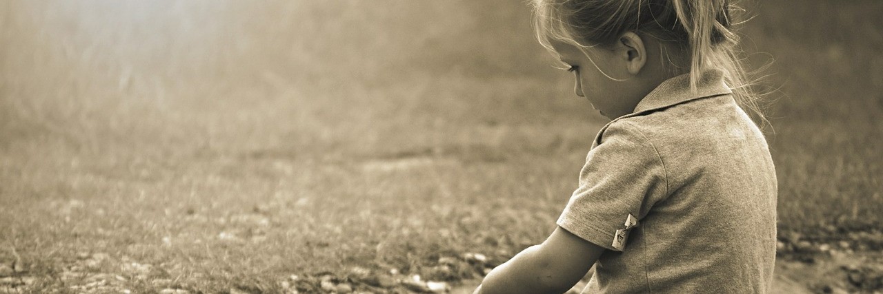 When Your Child Receives a Sensory Processing Disorder Diagnosis Child sitting.