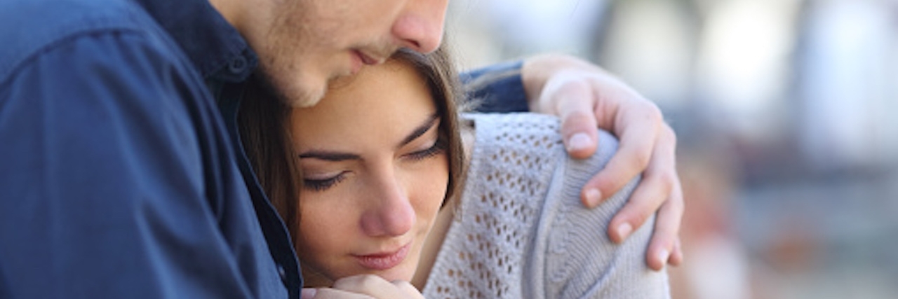 Tips for Dating Someone With Anxiety man comforts girlfriend