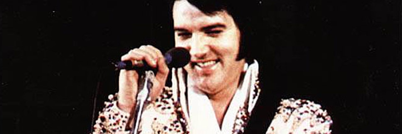 Elvis singing and smiling