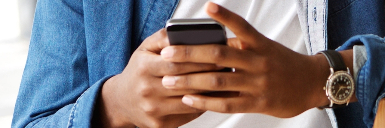 How to Deal With FOMO Because of My Lupus Portrait of a guy using mobile phone and laptop