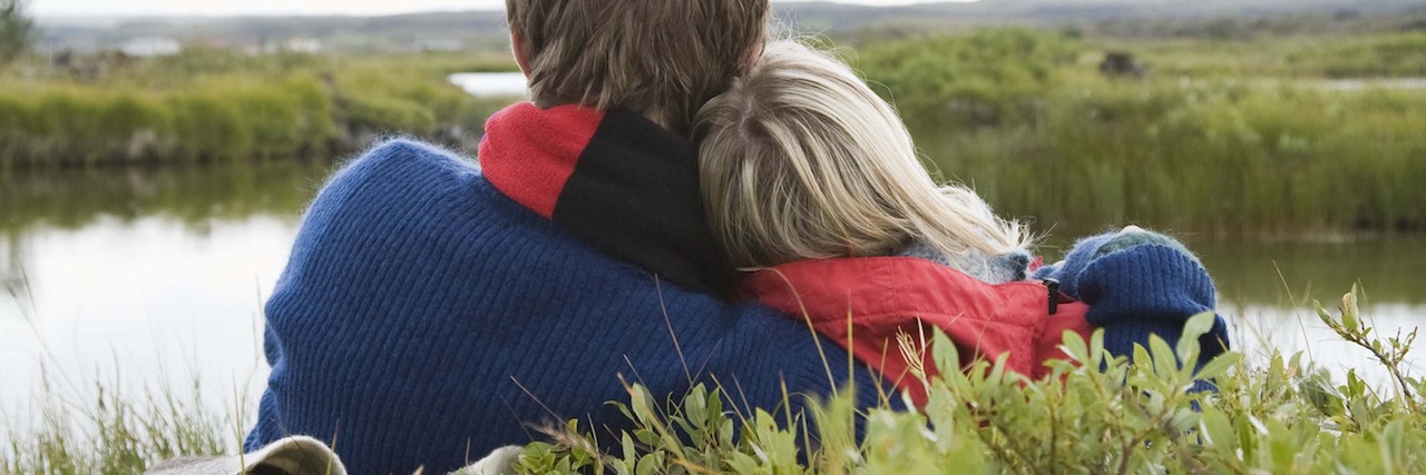 Why I Don't Say 'I'm Sorry' About My Chronic Lyme Disease Affectionate couple sitting by lake