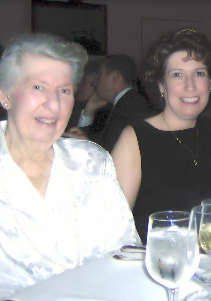 mom and her adult daughter sitting at a table