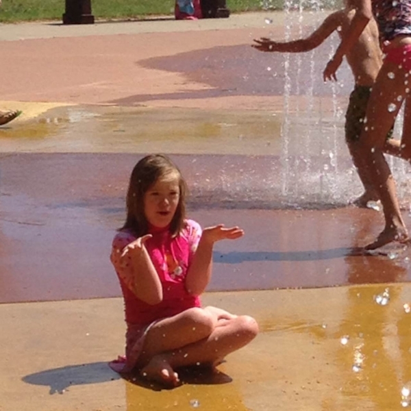 daughter with down syndrome playing at waterpark