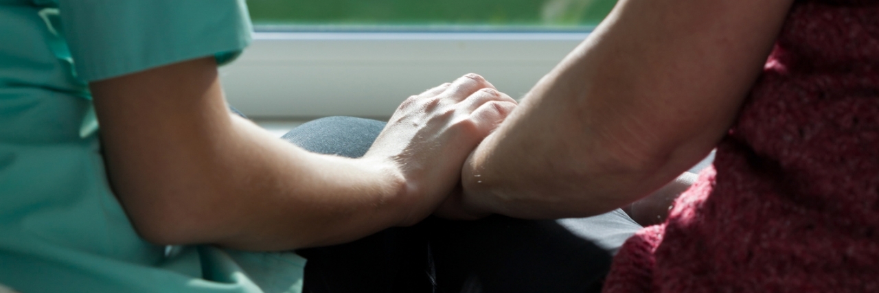 Letter to Nurse Who Comforted Me in the Hospital Ill woman sitting with young sympathetic nurse