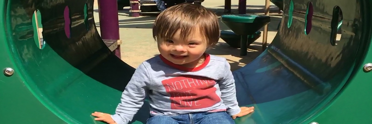Down Syndrome and Telling My Family's Story Owen on the playground.