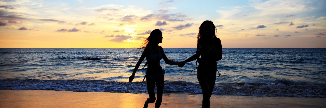 Women Who Left Eating Disorder Treatment Two women walk together on the beach.