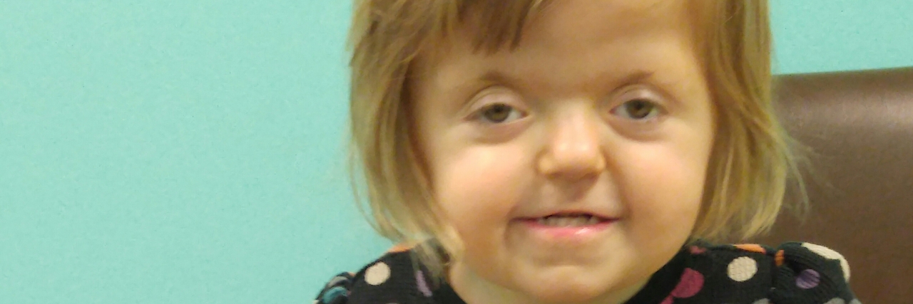 The Difficult Questions When Parenting a Child With Apert Syndrome Sarah smiling