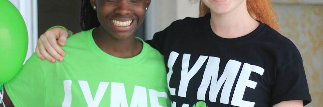 The author and her friend wearing Lyme Walk t-shirts