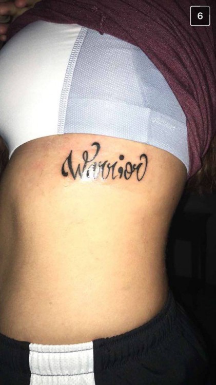 Tattoo that reads "warrior"