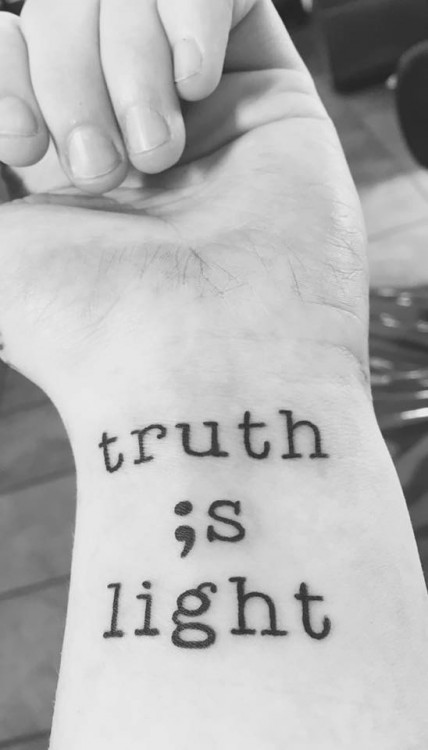 Tattoo that reads: Truth is light.