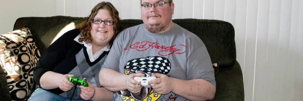 Mitchondrial Disease and Feeling Self-Conscious About My Body/Weight wife and husband playing video games on couch