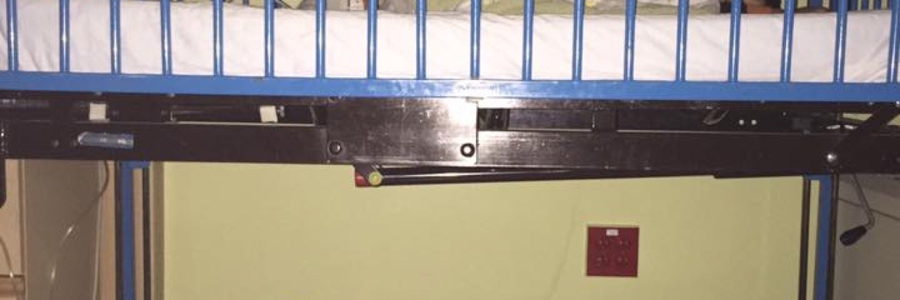 Dad Sleeps Under Son's Hospital Bed After Working 3 Shifts Andre Palmer asleep on the floor