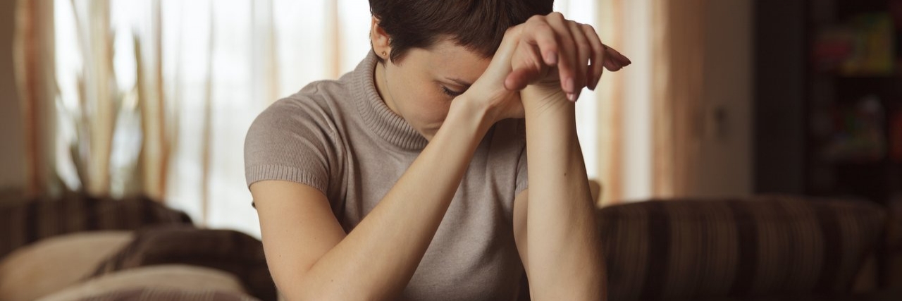 Seeking Help for My Endometriosis From Family and Friends woman sitting at a table