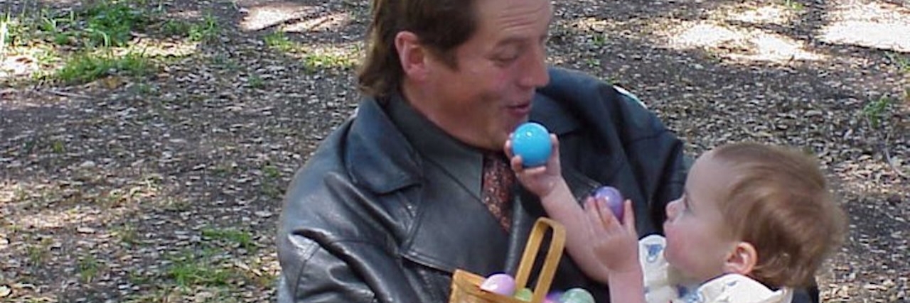 Losing a Father to Suicide: 10 Years Later dad holding baby on easter