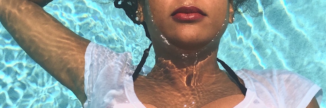 Being Told 'You're Too Pretty' to Be Depressed Woman floating in a pool of water