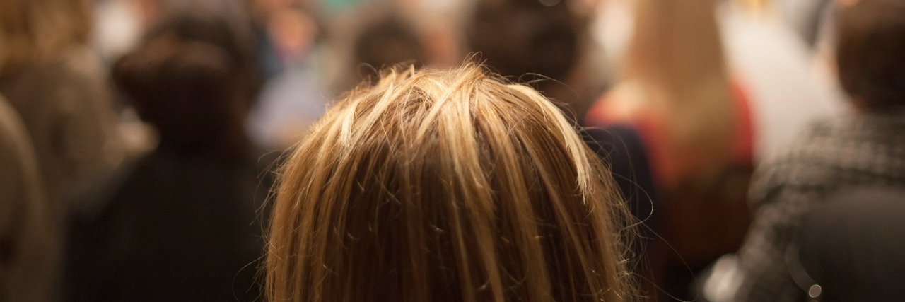 Living With the Fear of Rejection Because of Chronic Illness woman in a crowd