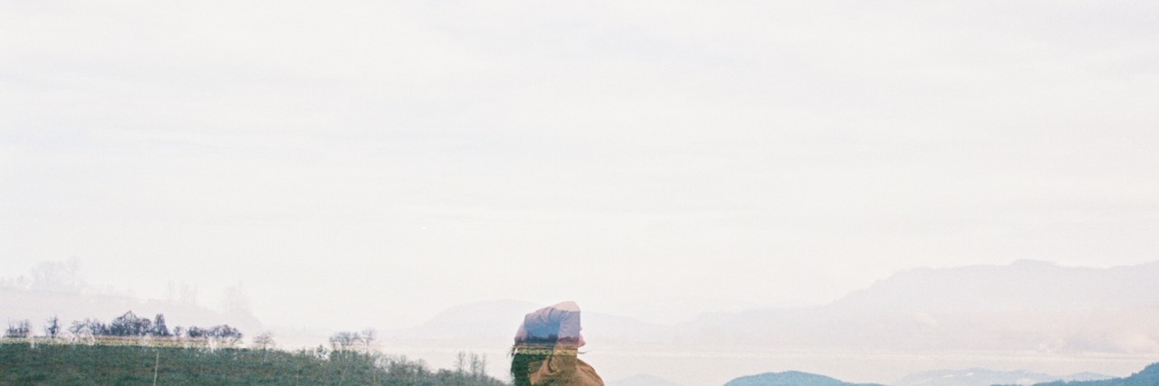 Experiencing Physical Symptoms From My Panic Disorder woman standing in an empty field