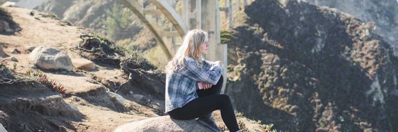 When I Quit My Job Because of My Chronic Fatigue Syndrome Fran Dargaville sitting near a bridge