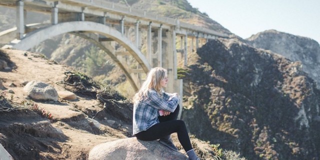 When I Quit My Job Because of My Chronic Fatigue Syndrome Fran Dargaville sitting near a bridge