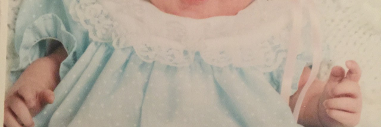 Losing My Daughter to Shwachman-Diamond Syndrome cami smiling as a baby
